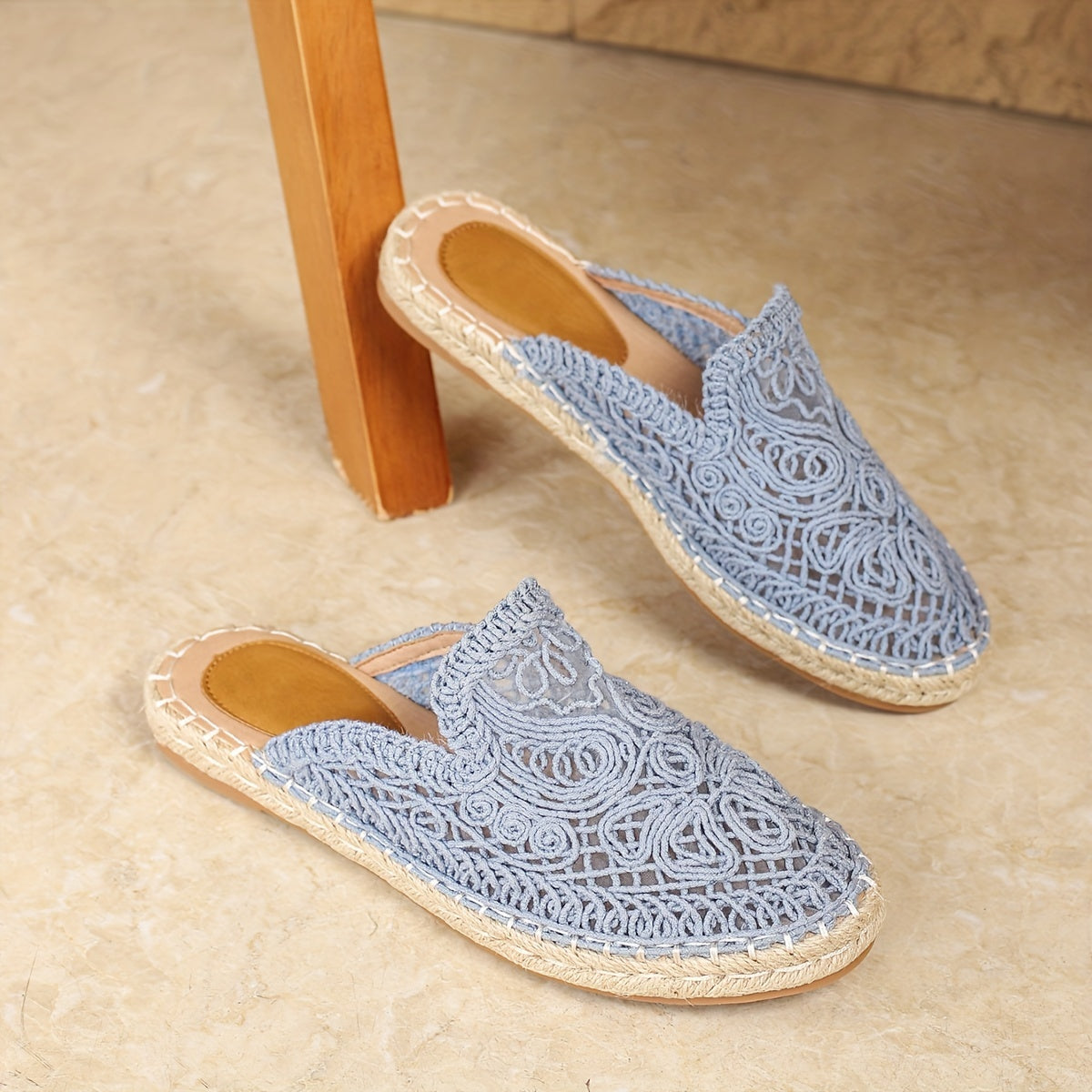 Huizhou's Summer Floral Mules for Women: Lightweight vacation slides with embroidered detailing, round toe, and flat heel, ideal for the beach.