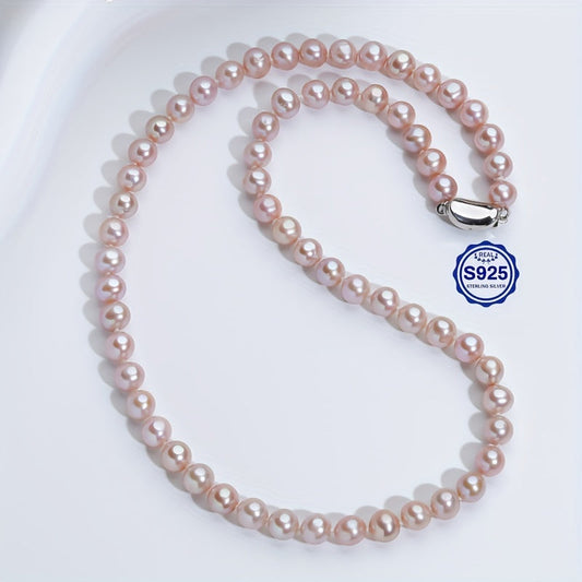 This stunning necklace features 6-7mm pink and purple freshwater cultured pearls. The near-round shape of the pearls adds an elegant touch, while the AAAA+ high luster ensures a dazzling finish. Despite minor flaws, these pearls exude a dainty and