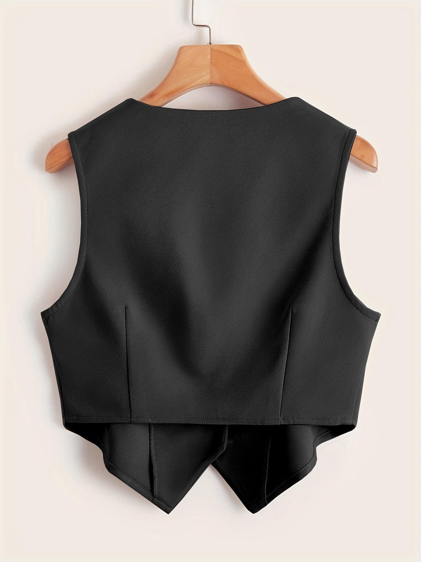 Sleeveless button-front vest with V-neck for women's workwear.