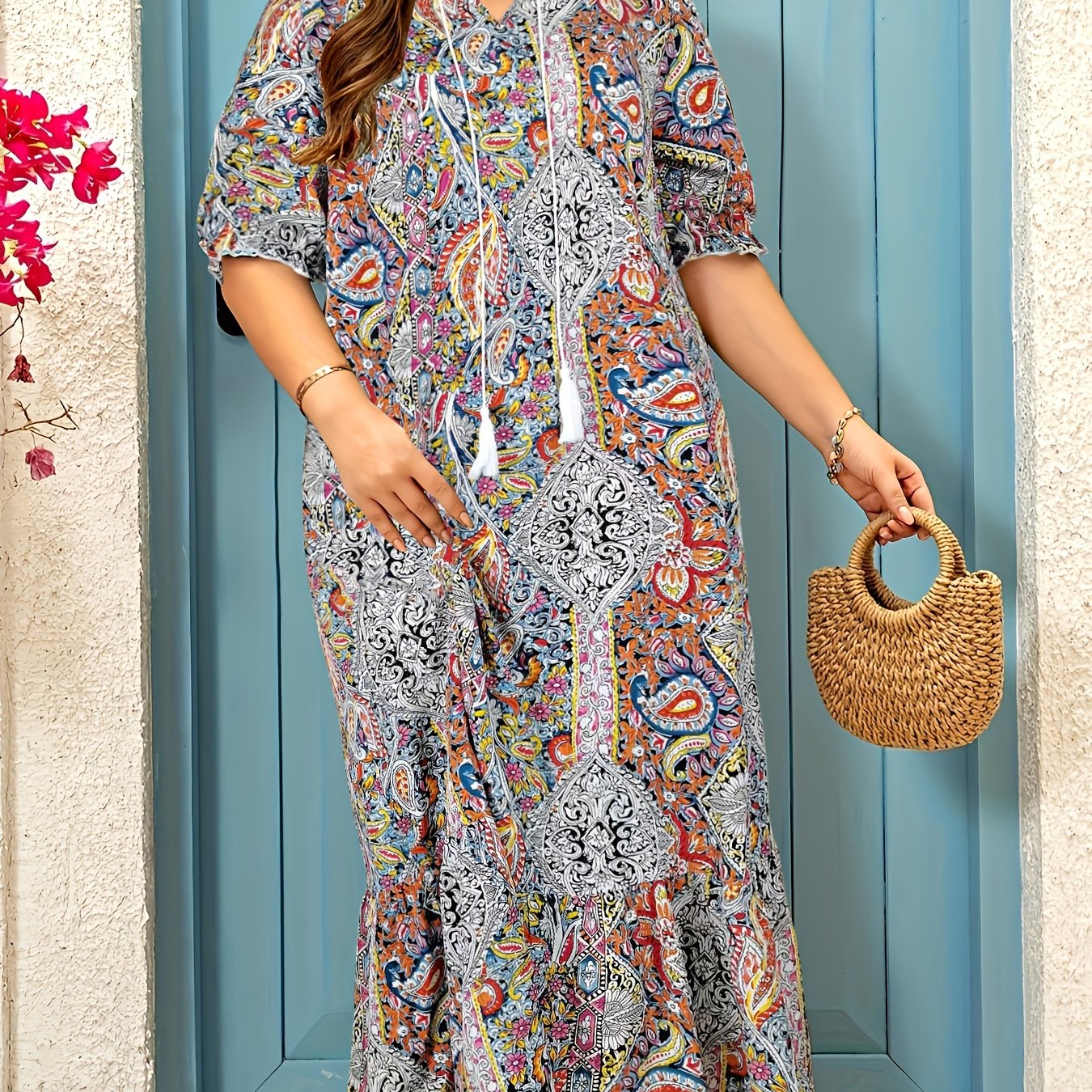 Stylish paisley print V-neck dress with ruffle hem and tassel detail. Made of polyester, machine washable. Perfect summer fashion for women.