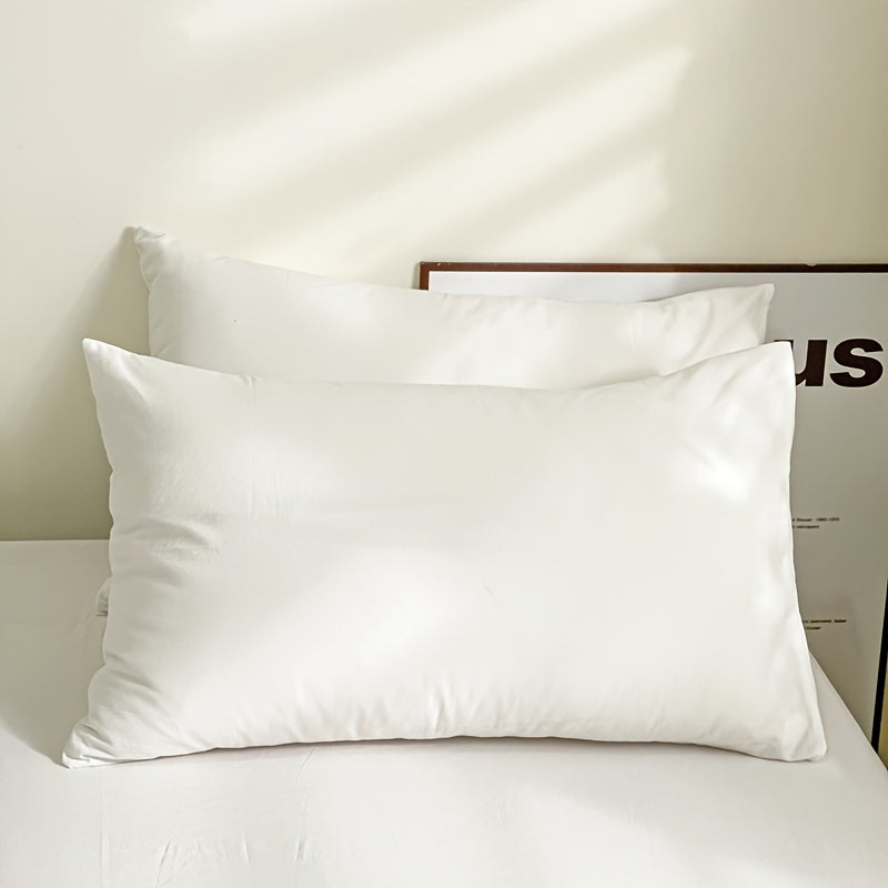 Choose from three different colors - Pure White, Gray, or Navy Blue, with this set of two solid color versatile pillowcases. Made from soft and breathable material with a frosted treatment, these pillowcases are machine washable and come without any