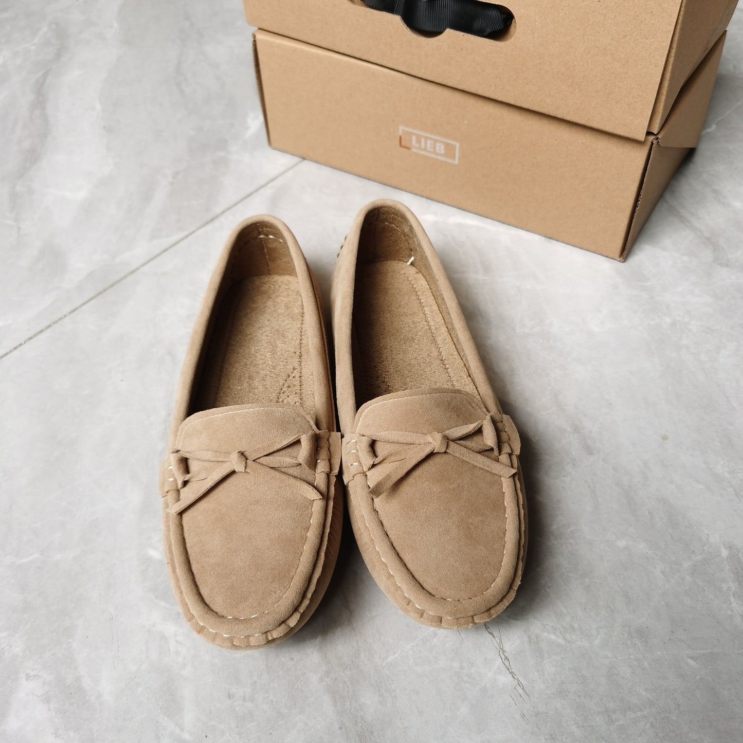 Retro flat loafers with bow detail, slip on style, and soft sole for casual wear.